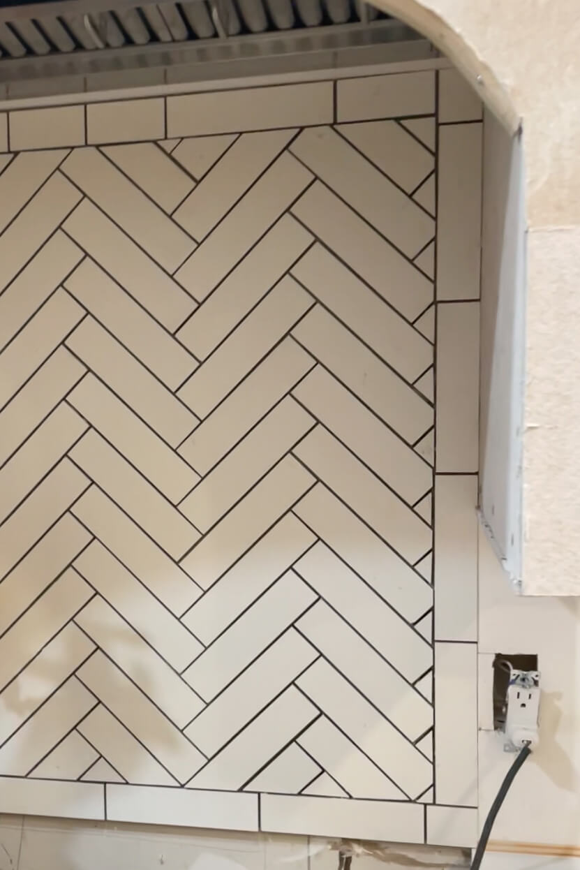 DIY herringbone tile backsplash without grout.